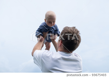 portrait of young father hugging his little daughter 93675403