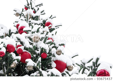Beautiful fir tree decorations and lights of traditional Christmas fair. Holidays concept. Winter holiday season background. 93675437
