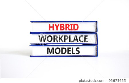 Hybrid workplace models and support symbol. Concept words Hybrid workplace models on books. Beautiful white table white background. Business and Hybrid workplace models quote concept. Copy space 93675635