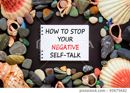 Stop negative self-talk symbol. Concept words How to stop your negative self-talk on beautiful black background. Sea stones and seashells. Psychological stop negative self-talk concept. Copy space. Stop negative self-talk symbol. Concept words How to stop your negative self-talk on beautiful black background. Sea stones and seashells. Psychological stop negative self-talk concept. Copy space. 93675682