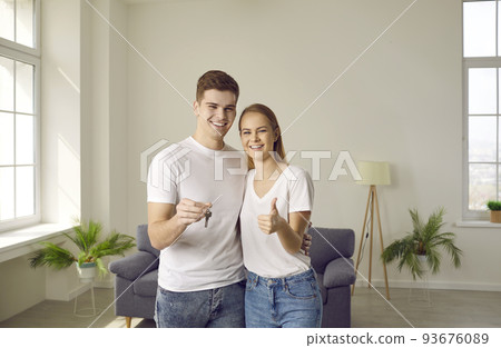 Portrait of happy joyful young family who is happy to buy home and move into new apartment. 93676089