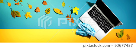 Laptop computer with masks in autumn Laptop computer with masks in autumn 93677487