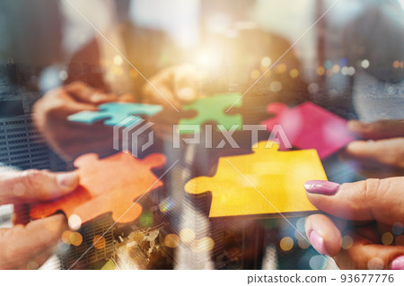 Teamwork of partners connect puzzle pieces as integration and startup Teamwork of partners connect puzzle pieces as integration and startup 93677776