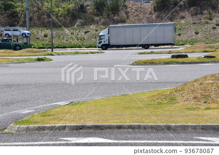 A service area in the Kansai area of Japan A truck parked in a parking lot A service area in the Kansai area of Japan A truck parked in a parking lot 93678087