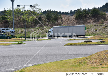 A service area in the Kansai area of Japan A truck parked in a parking lot 93678088