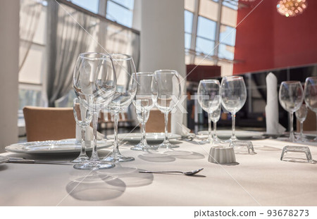 Wine glasses in warm light loft restaurant. 93678273