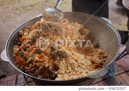 Hiking pot, Bowler in the bonfire. in cauldron at the stake. Traveling, tourism, picnic cooking, cooking at the stake in a cauldron, fire and smoke. 93678307