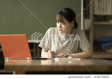 Students studying with digital textbooks 93679403