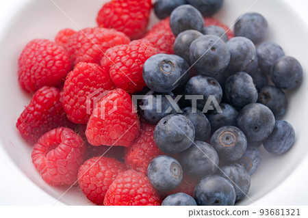 Raspberry and blueberries 93681321