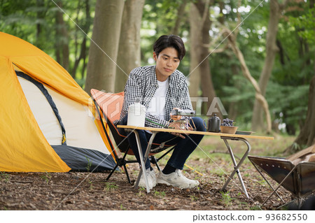 Men enjoying solo camp 93682550