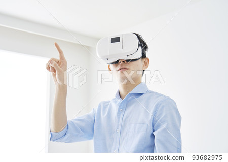 A man experiencing the Metaverse A man experiencing the Metaverse 93682975