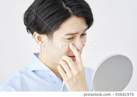 Man with sore eyes looking in the mirror Man with sore eyes looking in the mirror 93682978