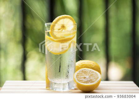 Lemonade and fresh lemons on wooden table Lemonade and fresh lemons on wooden table 93683004