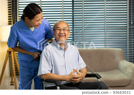Asian Nurse take care Elderly Senior Man with warm welcome. 70s Mature Man patient has good health and support help by Caregiver from medical hospital. Grandfather sit on wheelchair, copy space 93683031