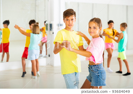 Portrait of children enjoying of partner dance in class Portrait of children enjoying of partner dance in class 93684049