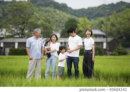 Summer vacation A group photo of a three-generation family returning to their hometown Taken on a footpath in the countryside 93684141