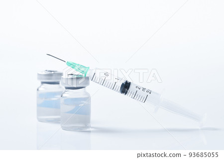 Syringe and vial placed on white background Syringe and vial placed on white background 93685055