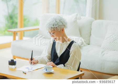 Woman writing a letter Woman writing a letter 93685617