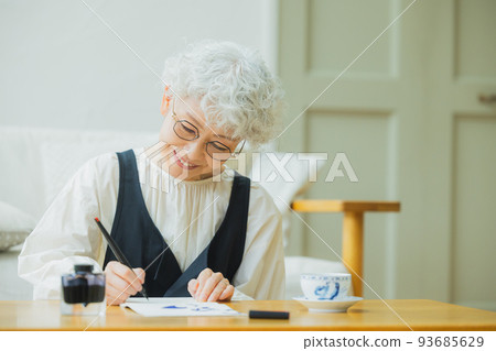 Woman writing a letter 93685629