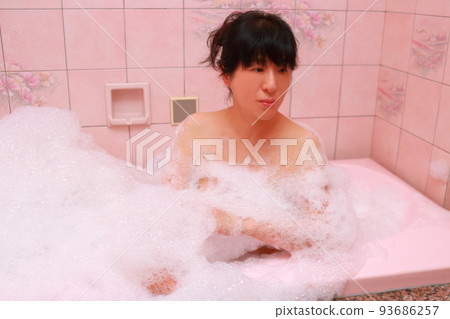 Woman taking a bath bubble bath version Woman taking a bath bubble bath version 93686257