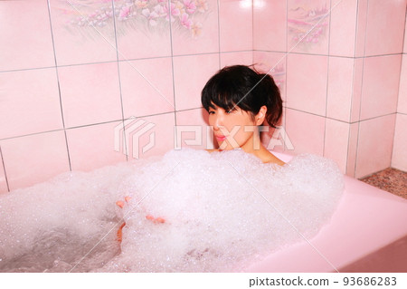 Woman taking a bath bubble bath version Woman taking a bath bubble bath version 93686283