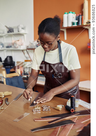 Young Woman Creating Handmade Belt 93686825