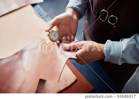 Craftsman Choosing Genuine Leather Craftsman Choosing Genuine Leather 93686917