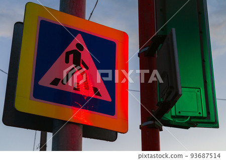 Pedestrian crossing. Road sign with colorful illumination 93687514