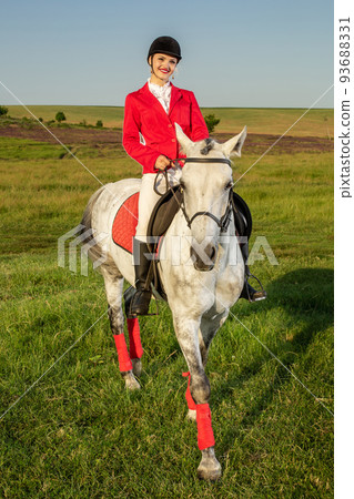 The horsewoman on a red horse. Horse riding. Horse racing. Rider on a horse. The horsewoman on a red horse. Horse riding. Horse racing. Rider on a horse. 93688331