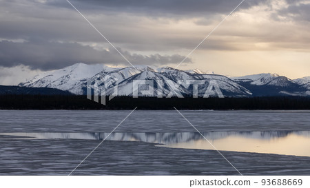Yellowstone Lake with snow covered mountains in American Landscape 93688669