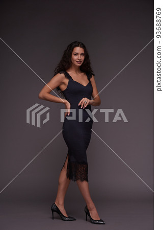 Full length portrait of young feminine woman in elegant dress and shoes Full length portrait of young feminine woman in elegant dress and shoes 93688769
