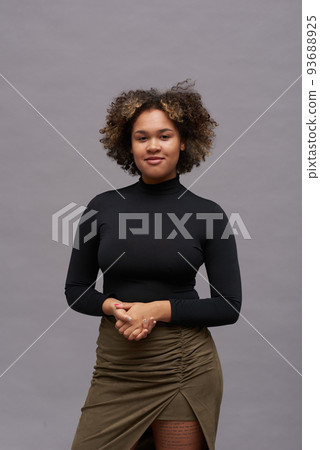 Young gorgeous black woman in elegant smart casualwear looking at camera 93688925