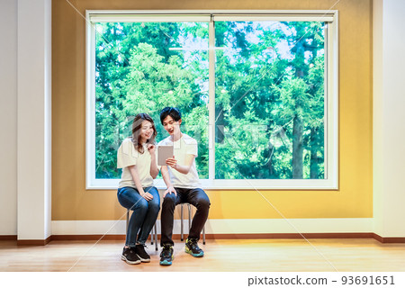 Young people checking the route at the trekking lodge 93691651