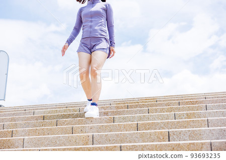 A woman aiming for weight loss on a staircase diet A woman aiming for weight loss on a staircase diet 93693235