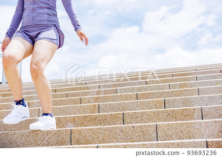 A woman aiming for weight loss on a staircase diet A woman aiming for weight loss on a staircase diet 93693236