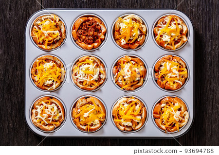sloppy joe cups in muffin tin, top view 93694788