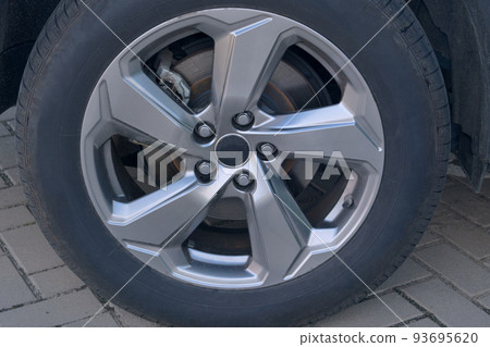 Car wheel protector, close up. Wheels of modern transport. Car wheel protector, close up. Wheels of modern transport. 93695620