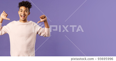 Portrait of confident young upbeat man, smiling bragging, being boastful about own accomplishments, indicate himself with proud rejoicing face, standing purple background 93695996