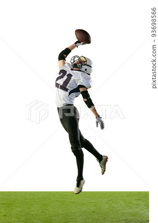 Full-length portrait of professional american football player in uniform training, jumping isolated over white background 93698566