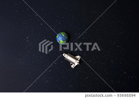 Earth and spaceship on cosmic background Earth and spaceship on cosmic background 93698894