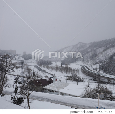 Winter scenery of Yuzawa. A snowy heavy snow day. 93698957
