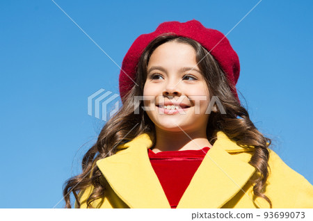 Childhood is about happy memories. Small girl wear fall outfit outdoors. Autumn bucket list. Farewell to autumn. Last autumn beams. Ideas for autumn leisure. Smiling little kid in hat sky background 93699073