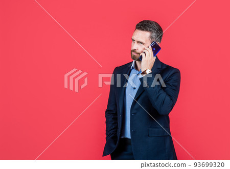 mature ambitious man businessman in businesslike suit talk on phone, copy space, negotiation mature ambitious man businessman in businesslike suit talk on phone, copy space, negotiation 93699320