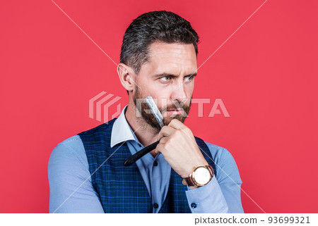 mature serious man barber with wristwatch shaving with retro razor blade, hair care mature serious man barber with wristwatch shaving with retro razor blade, hair care 93699321