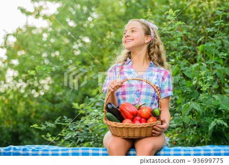 New food. healthy food for children. kid on summer farm. Organic food. little girl vegetable in basket. Only natural. happy little farmer. autumn harvest. harvest vitamin. spring market garden New food. healthy food for children. kid on summer farm. Organic food. little girl vegetable in basket. Only natural. happy little farmer. autumn harvest. harvest vitamin. spring market garden 93699775