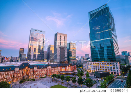 Tokyo cityscape in Japan New view of Tokyo station. Rows of skyscrapers (sunset reflected in window glass) Tokyo cityscape in Japan New view of Tokyo station. Rows of skyscrapers (sunset reflected in window glass) 93699944