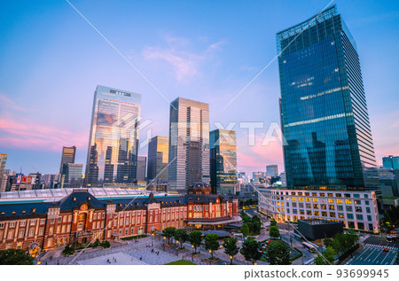 Tokyo cityscape in Japan New view of Tokyo station. Rows of skyscrapers (sunset reflected in window glass) 93699945