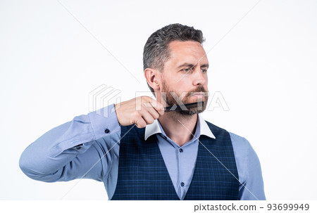 hairdresser concept. mature professional barber hold comb. 93699949