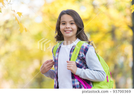 happy kid in casual style spend time walking in autumn forest enjoying good weather carry backpack, school time happy kid in casual style spend time walking in autumn forest enjoying good weather carry backpack, school time 93700369
