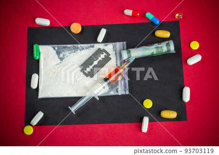Top view flat lay many various drugs ready for use. Syringe with pills and razor. Top view flat lay many various drugs ready for use. Syringe with pills and razor. 93703119